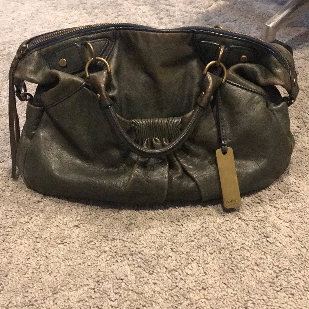 Navy Botkier bag.has double handles shoulder strap